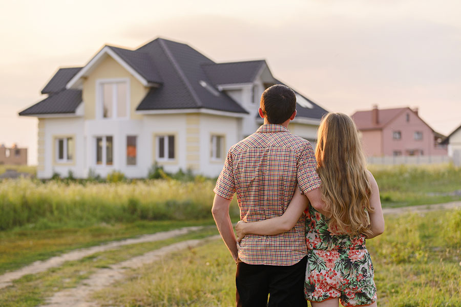 Header - Couple Looking At New Home